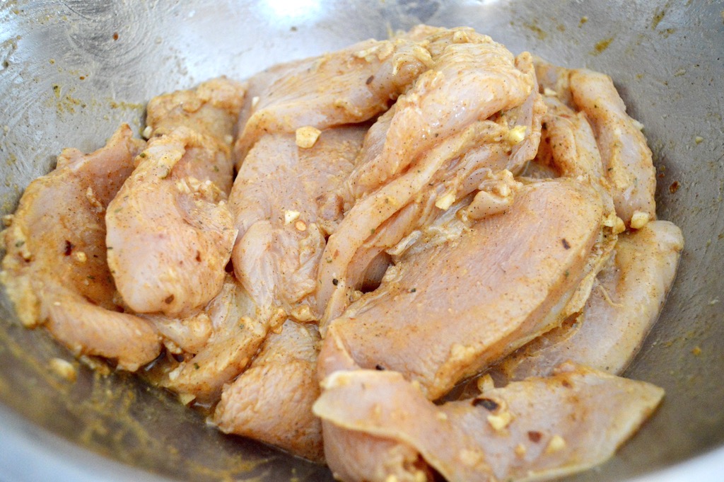 The key to this chicken shawarma was slicing the chicken really thinly. If I had a deli slicer that would have been even more ideal but I did the best I could with my knife. Then the chicken sat in an incredible flavorful marinade for an hour to really absorb it! 