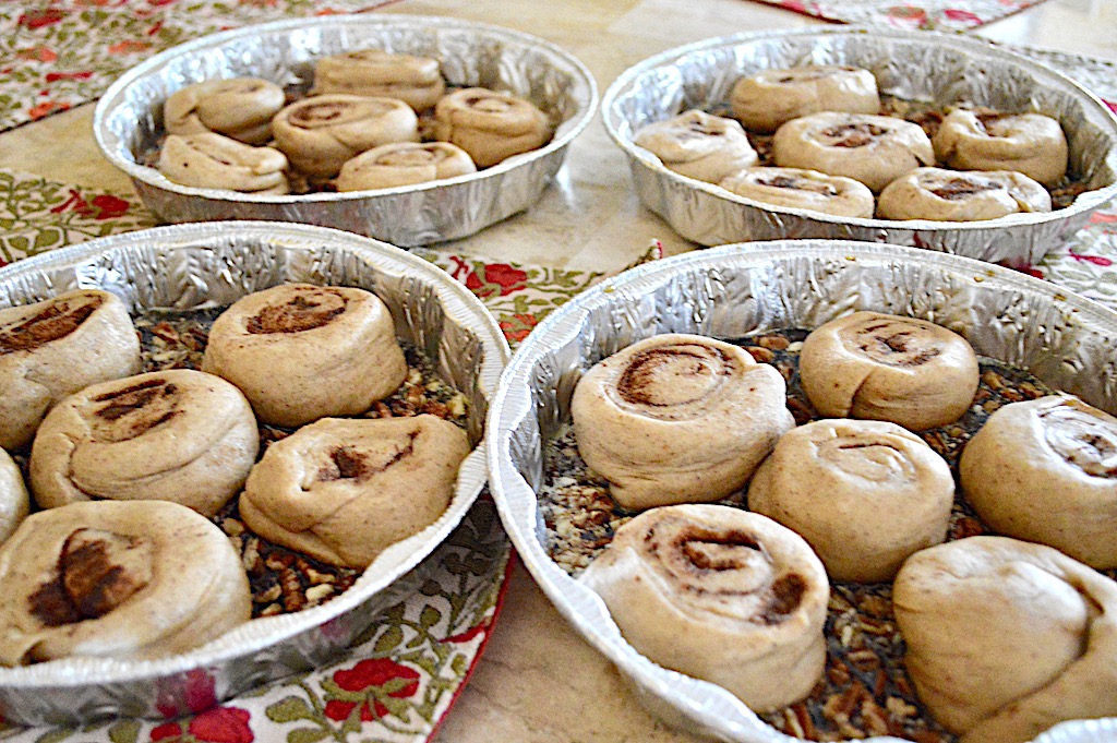 After repeating the process with the other half of dough, I had 24 gingerbread sticky buns on my hands. 6 went into each of my prepared pans so that they would have lots of room to puff up. They needed to proof for another hour to really become airy and fluffy. 