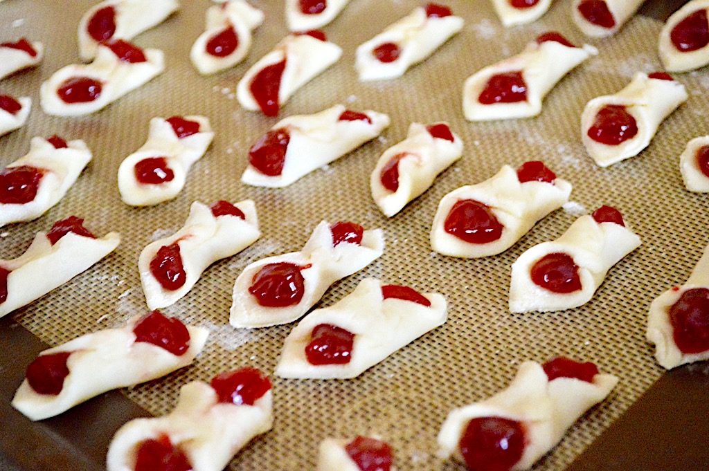 We pulled the opposite corners together and pressed them together well. I loved the pretty filling all enrobed in the dough! They looked like tiny cannoli. They needed about 10-12 minutes to become golden and gorgeous. 