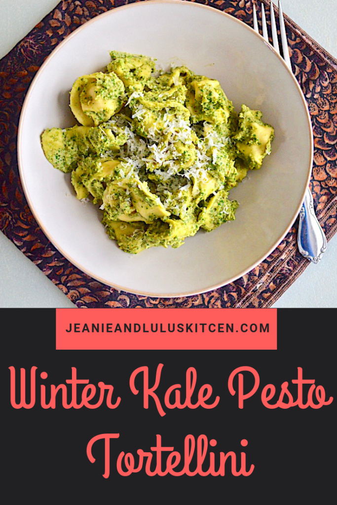 This is such a wonderful winter kale pesto made more substantial with white beans, served over tender cheese tortellini. Perfect for a vegetarian dinner! #pasta #kale #whitebeans #winterkalepesto #jeanieandluluskitchen