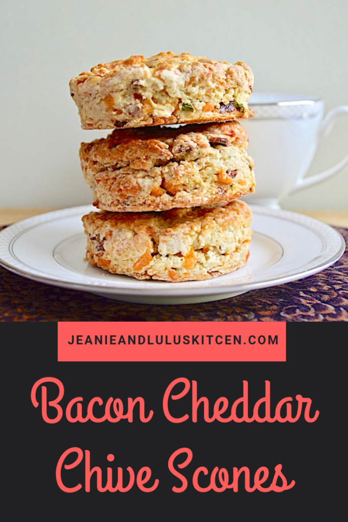 These bacon cheddar chive scones are so buttery, flavorful and wonderful for a savory breakfast or tea time bread! They're a meal in themselves. #scones #bread #baconcheddarchivescones #savoryscones #jeanieandluluskitchen