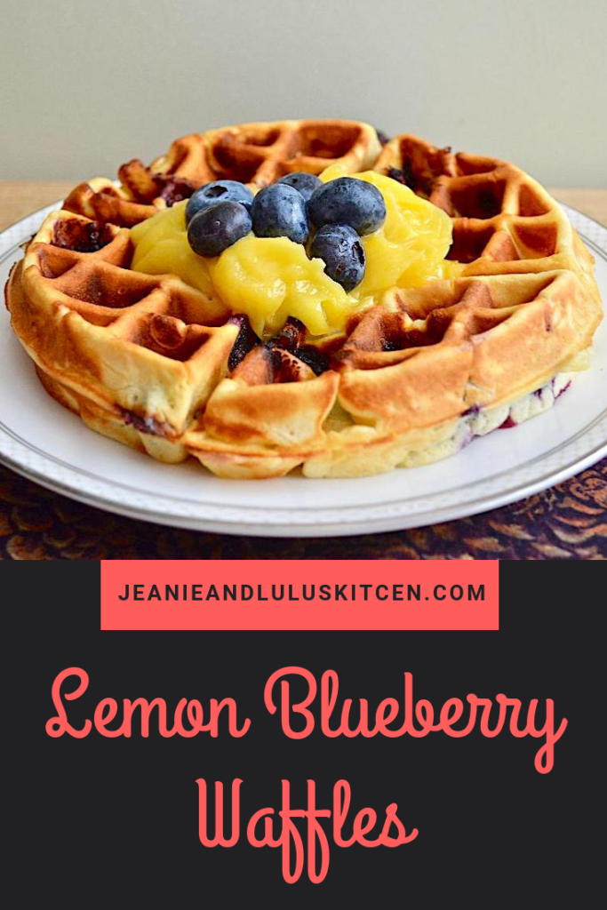 These lemon blueberry waffles are so fresh, bright and fluffy for brunch with the big bursts of juicy blueberries. The lemon curd tops them perfectly! #waffles #breakfast #brunch #lemonblueberrywaffles #jeanieandluluskitchen